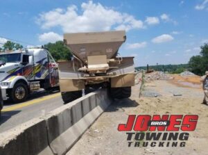Heavy Duty Towing required as fertilizer spreader hits the cement on Clark Bridge KY